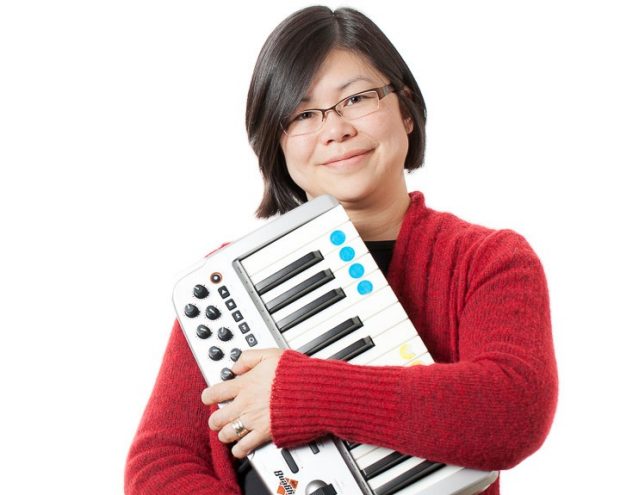 picture of Karen Li holding a midi keyboard