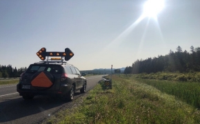 A research vehicle pulled over to the side of the highway