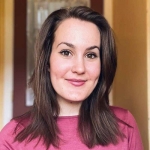 Photo of Hadassah Winters, a dark-haired young woman in a pink shirt