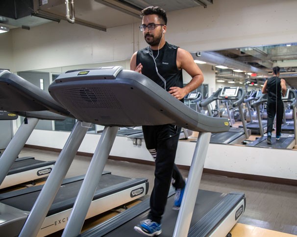 Student uses a treadmill at Le Gym