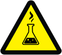 Yellow triangular warning sign with a black flask emitting fumes, indicating a chemical hazard.