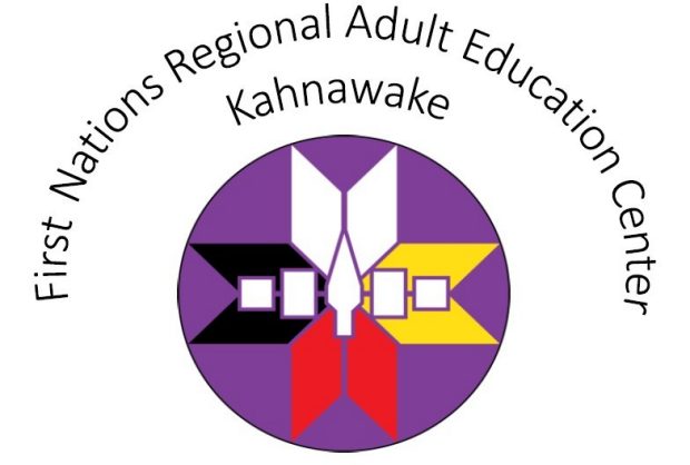 Logo for the First Nations Regional Adult Education Center showing a arrow head in the middle of a four colour illustrated graphic.