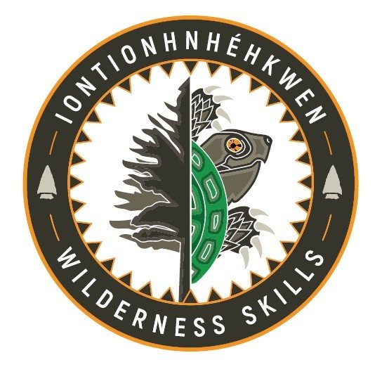 Logo graphic for Iontionhnhéhkwen Wilderness Skills showing a circular graphic held the image of a turltle ob the right side abd a conifer tree on the left side. The text, Logo graphic Iontionhnhéhkwen Wilderness Skills is shown around the outside of the centre graphic at the top and bottom. 