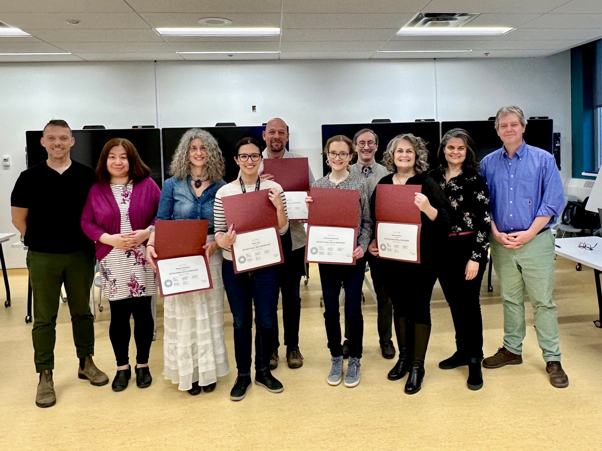 Ten person group photo of the first cohort of ISW faculty participants standing and holding their certificates along with the ISW facilitators. Ten person group photo of the first cohort of ISW faculty participants standing and holding their certificates along with the ISW facilitators.