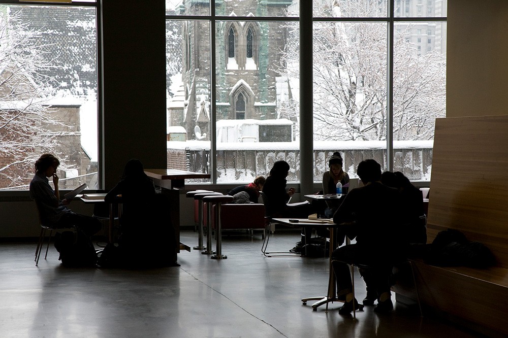 Open learning space with students studying and working