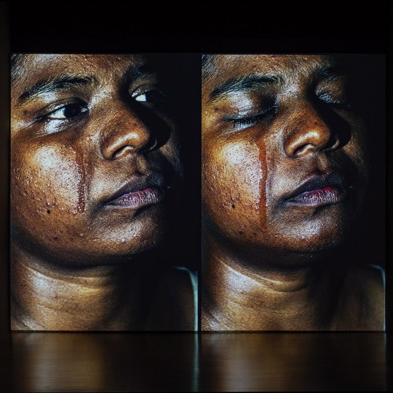 Two side-by-side images of a woman with a streak from crying down the cheek