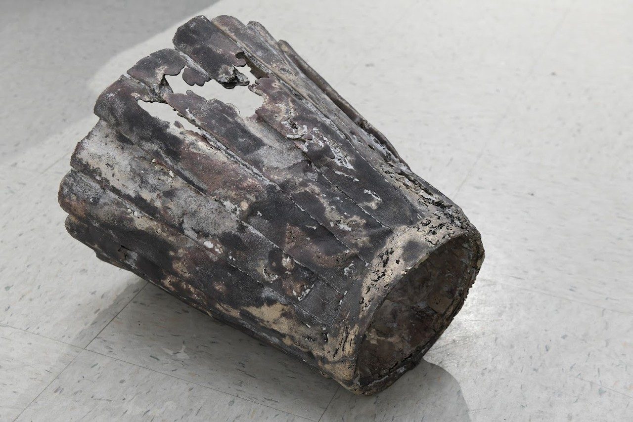 Bronze casted tennis skirt placed on the floor
