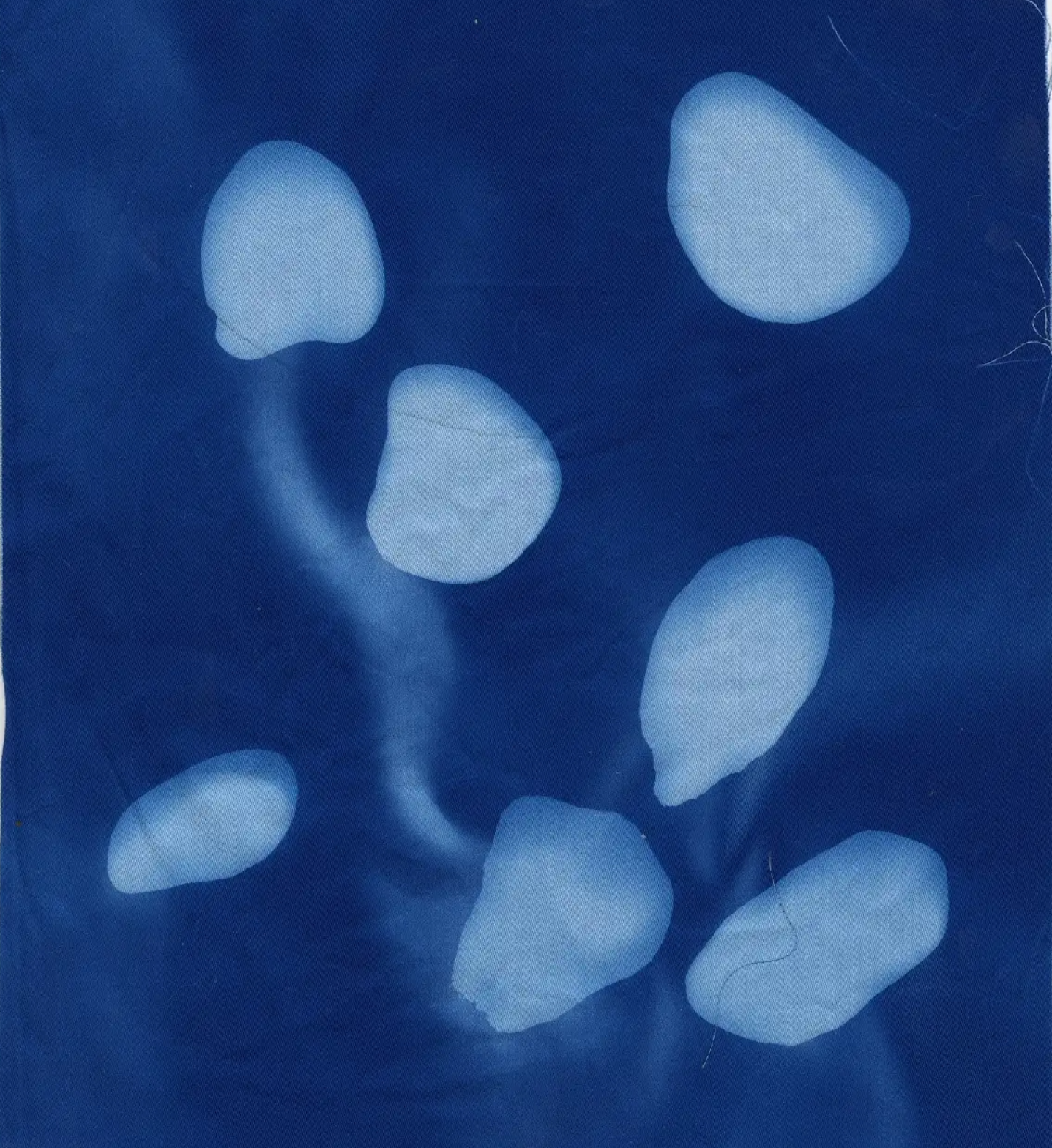Blurred print of rocks on dark blue fabric