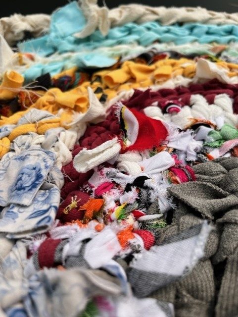 Untitled Breaded strips of colour fabric belonging to the artists in the exhibition, the curator, and assistant curator,