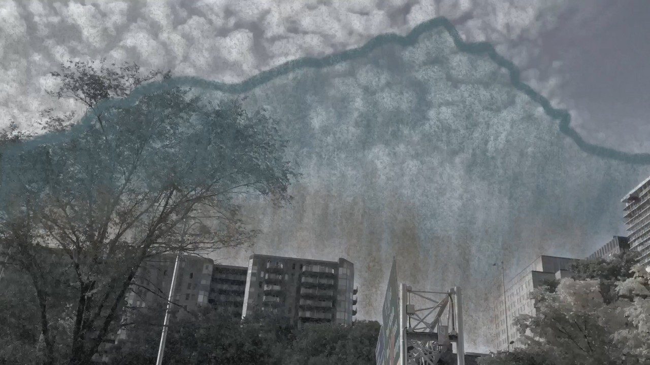 Buscando la Montaña (Finding the Mountain)/ Aquí y Allá (Here and There), 2022, Manipulated photograph of a Montreal sky view featuring the upper edge of an apartment tour, the top of a highway signage infrastructure, and the edge of a tree. Mountains and clouds were traced in grey-ish blue colour on the picture.