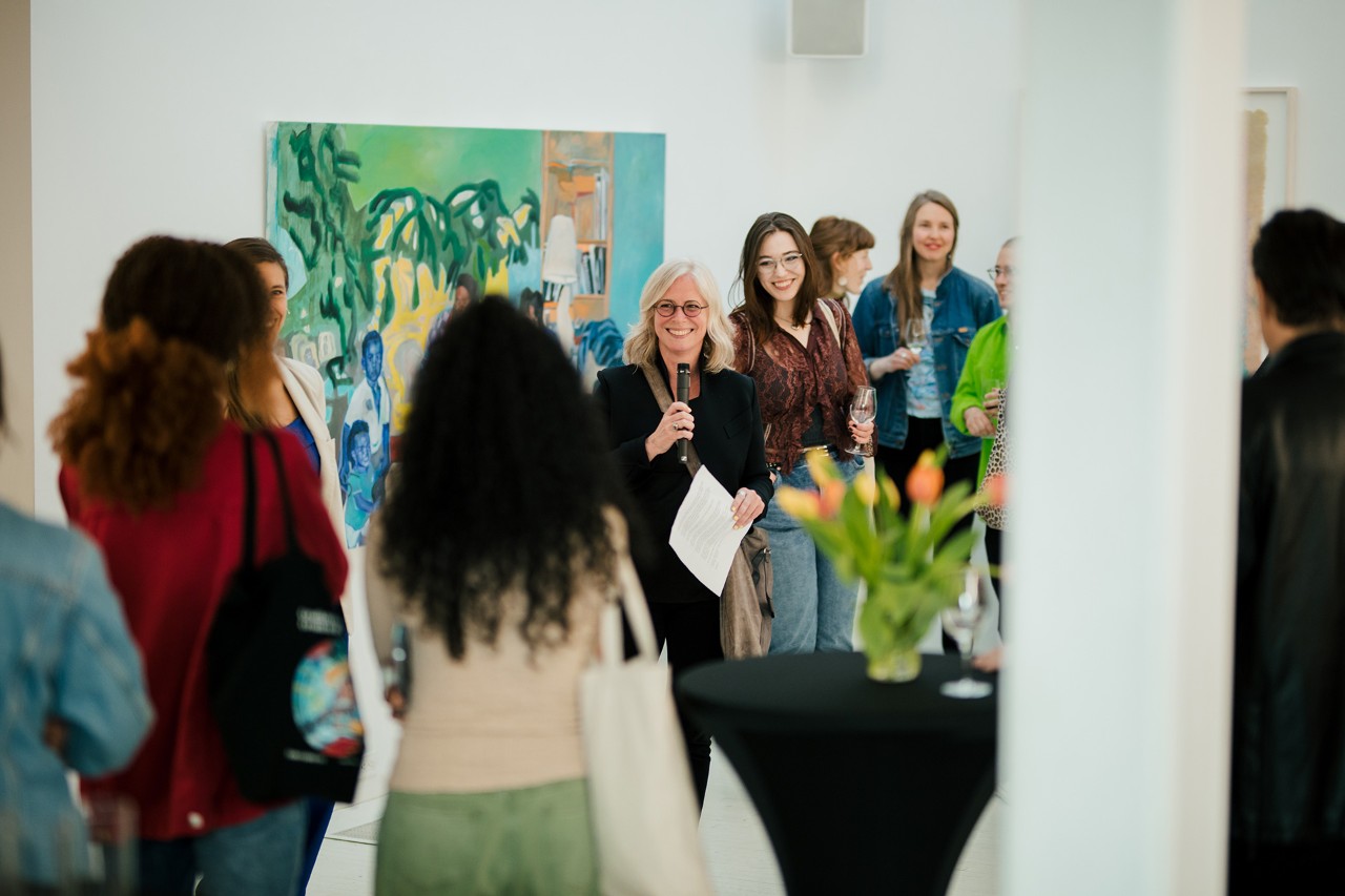 Dean Annie Gérin speaks to a crowd during an Art Volte event