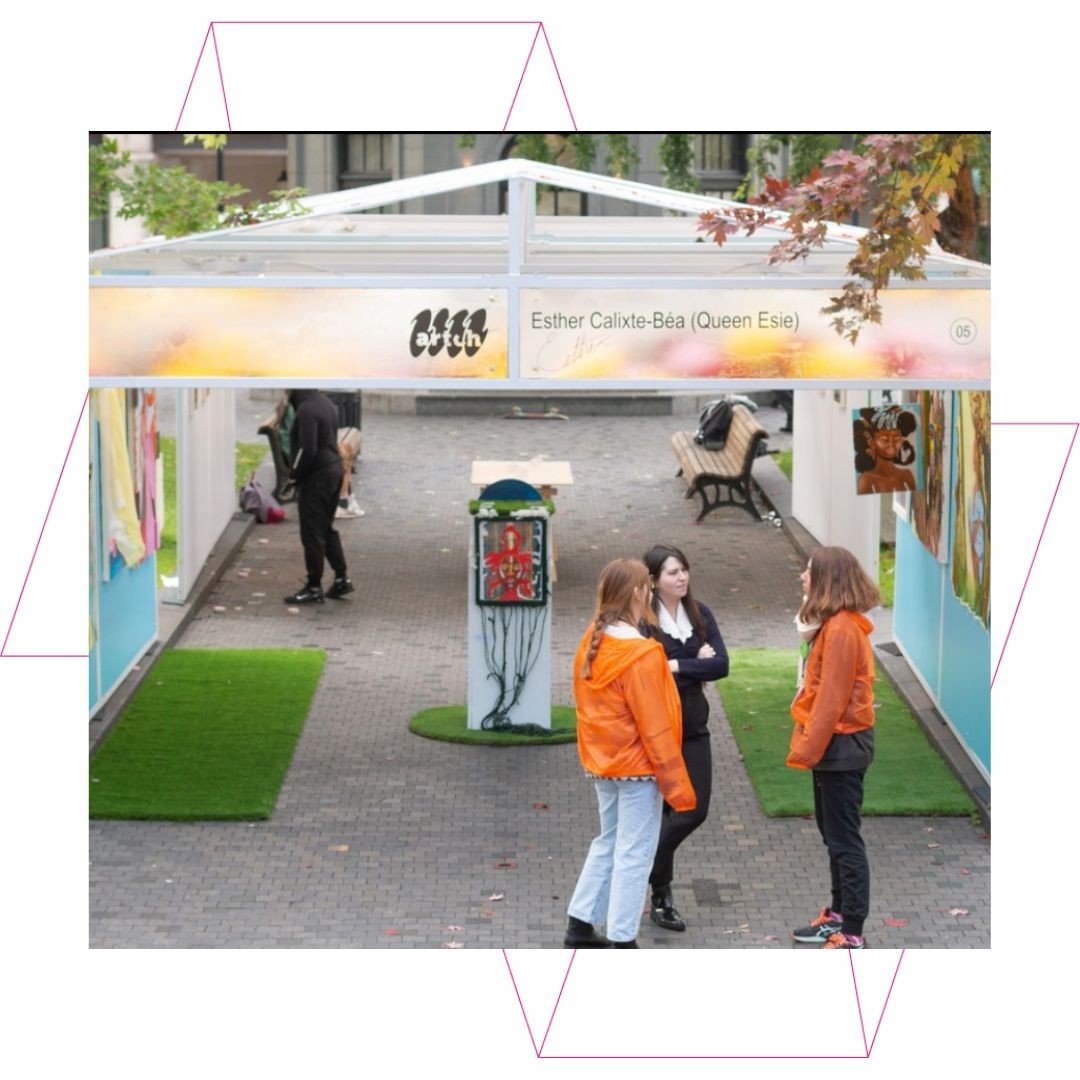Outdoor exhibition booth with people talking