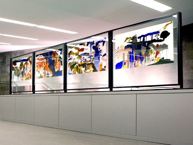The Four Seasons by Yehouda Chaki, 2010 an artwork in the hallway of a public space: colourful shapes in stained glass