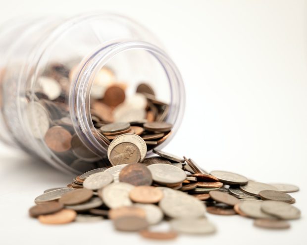 a jar of coins that has been knocked over