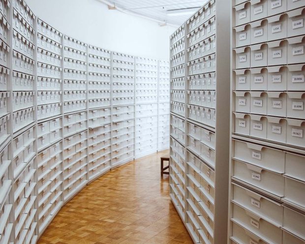 a hallway of floor to ceiling archivist's drawers
