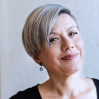 Close up of orange and black graphic that looks like a tape measure.