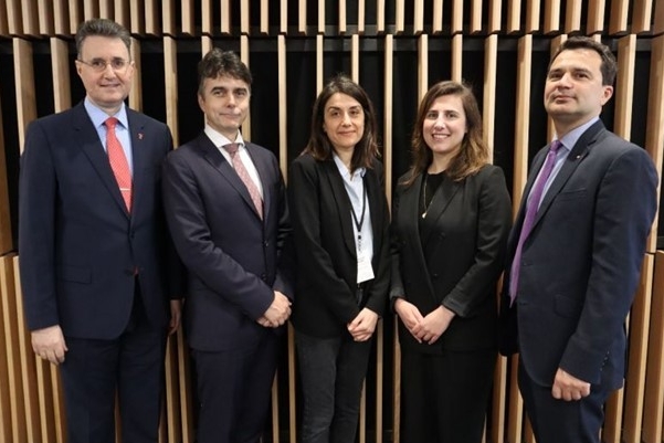 Group of people standing and posing for camera