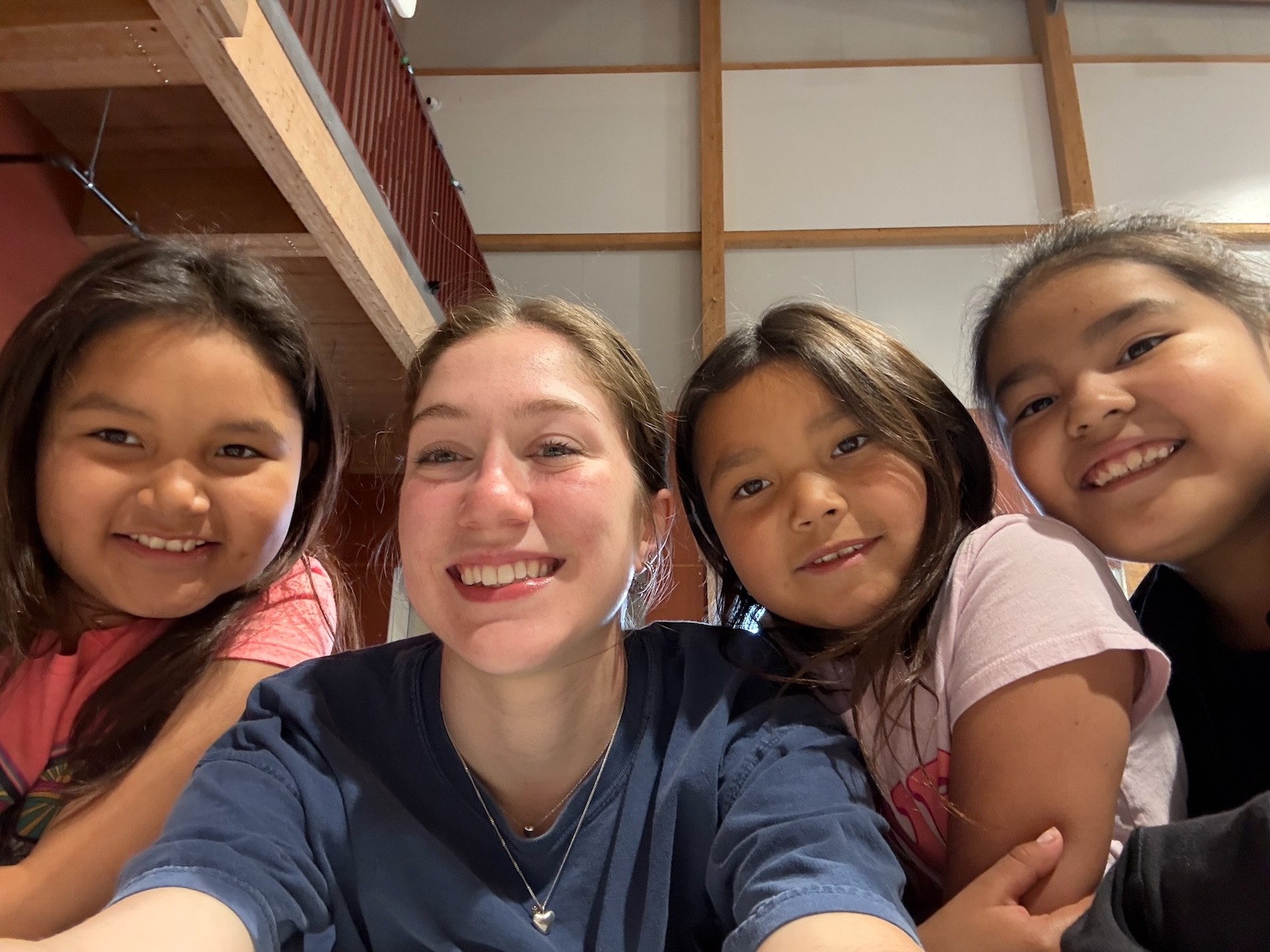Space Concordia student poses with Mistissini children