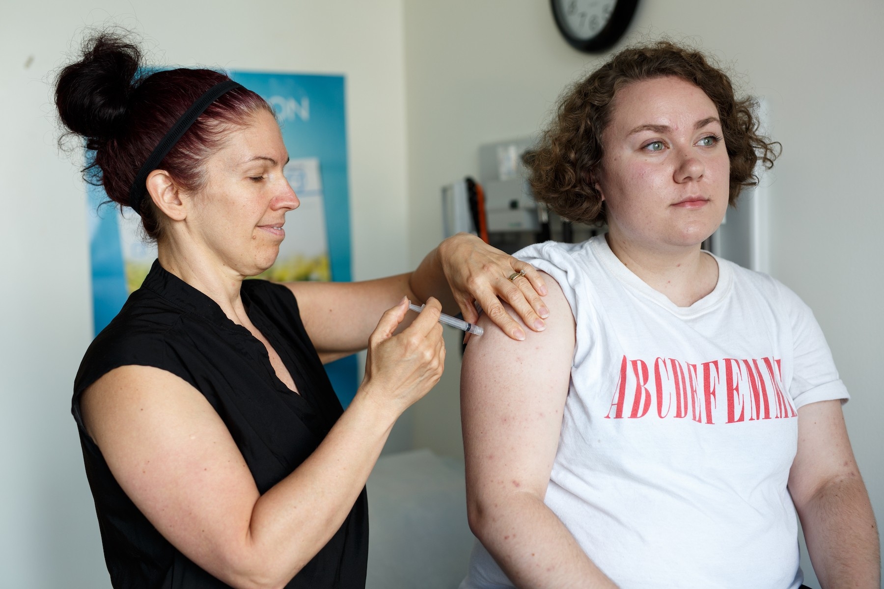 Nurse Josée vaccinates a student