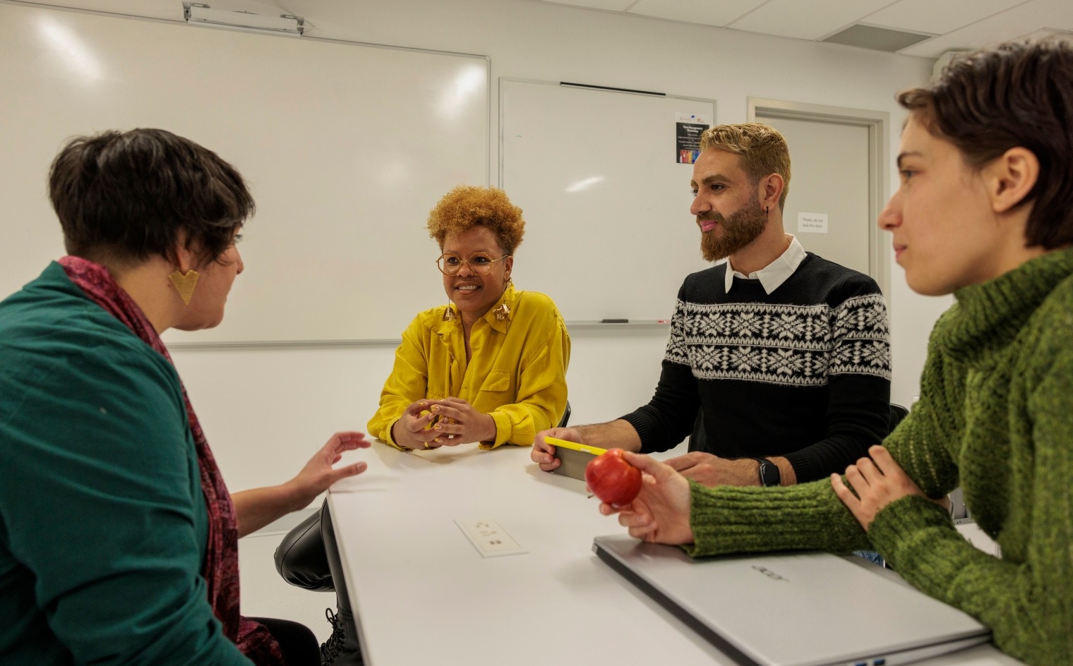 A leader speaks to her team members