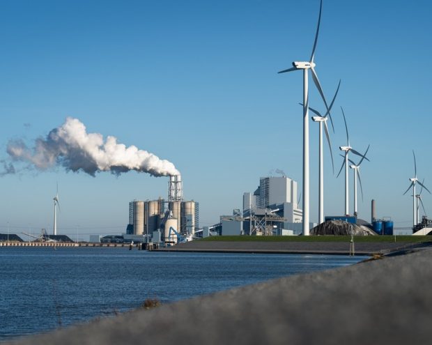 Fossil fuel station and wind turbines