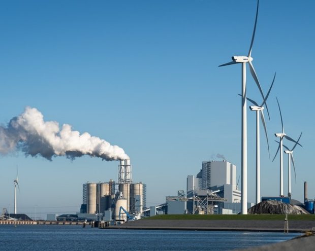 Fossil fuel station and wind turbines
