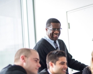A speaker presents at the MBA International Case Competition