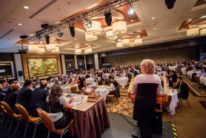 A speaker presents at the MBA International Case Competition