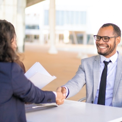 Successful business people meeting outside and closing deal