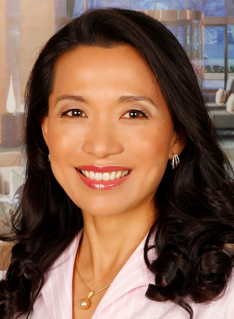 Headshot of Sukyong Yang, a smiling woman