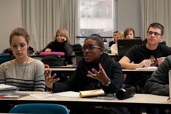 Student speaking in lecture hall