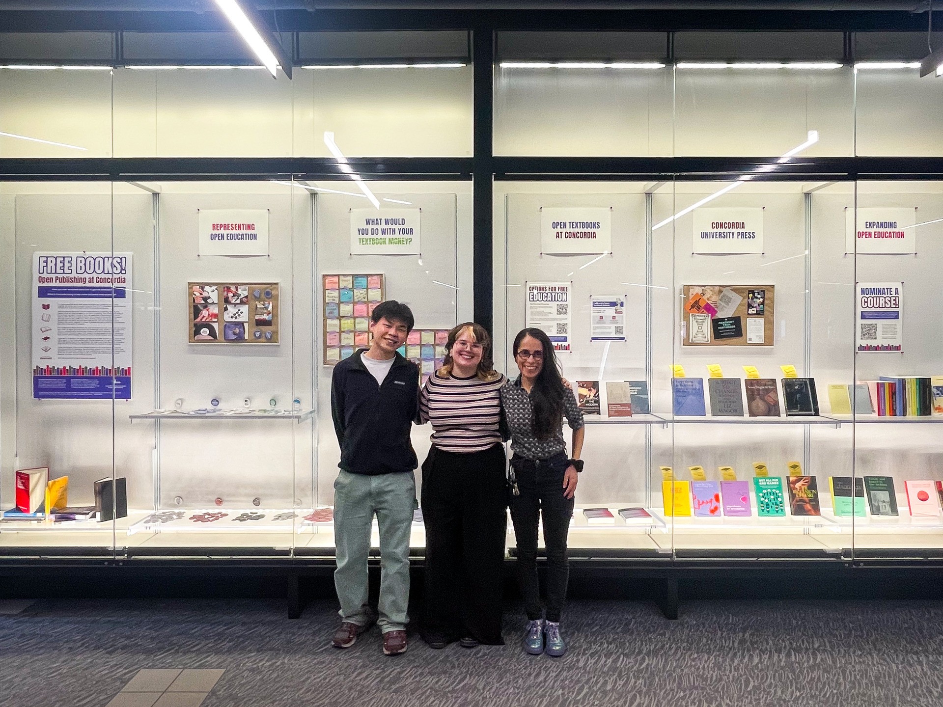 members of OER team infront of Free Books exhibition