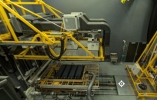 Heavy duty machine in a room that simulates solar and environmental conditions