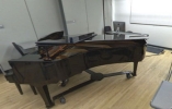 Thumbnail of a piano in a room with wooden floor