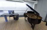 Thumbnail of the Jazz classroom with laminated wood floor tiles and piano