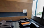 Lounge with leather couches next to a window