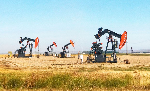 What happens when 50 reporters and 3 media outlets team up to investigate the price of oil?