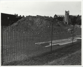 Fence enclosing a pile of dug up ground