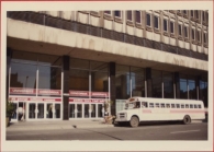 Hall Building with a university branded transport bus in front