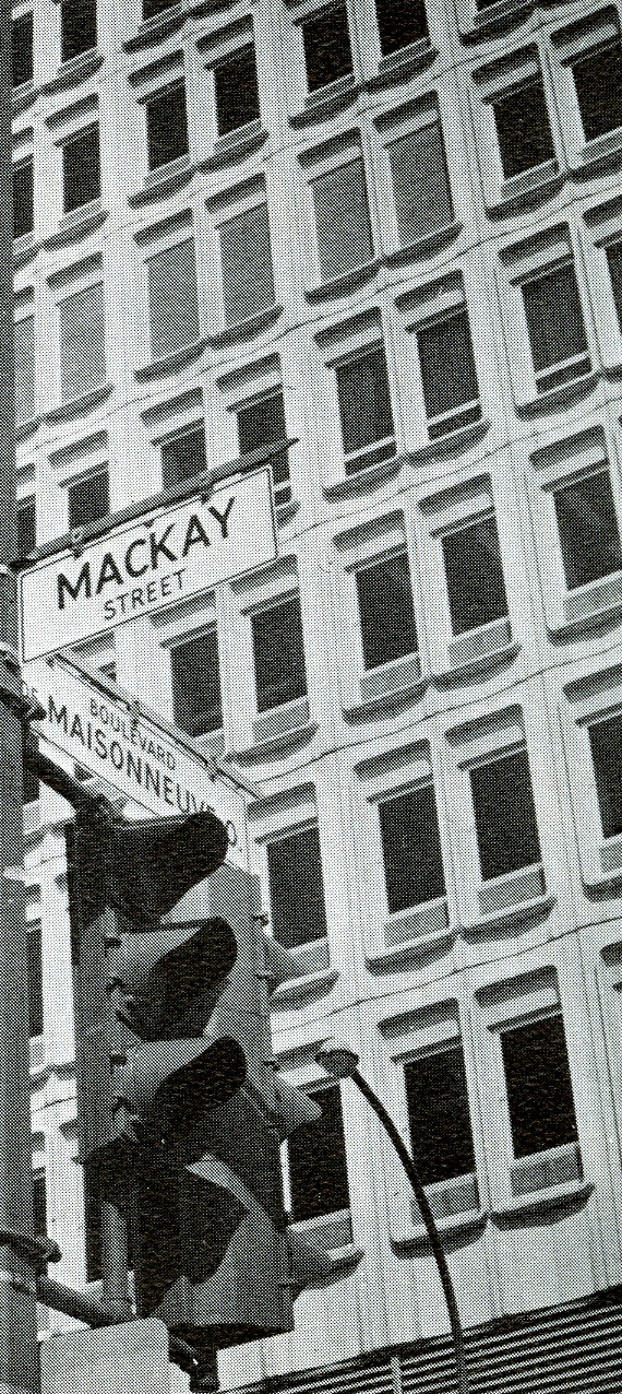 The street name signs at the intersection of Rue Mackay and Boulevard Maisonneuve