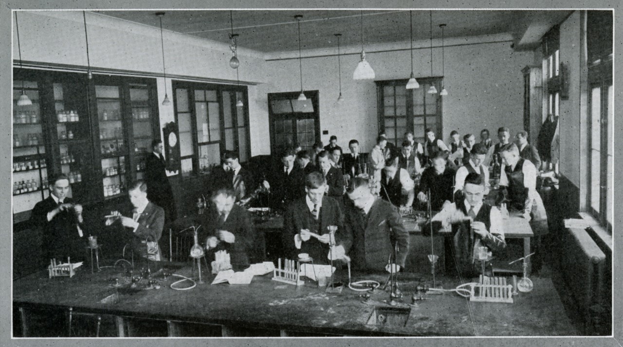 Old black and white photo of men in a science lab from Loyola College Review, 1922
