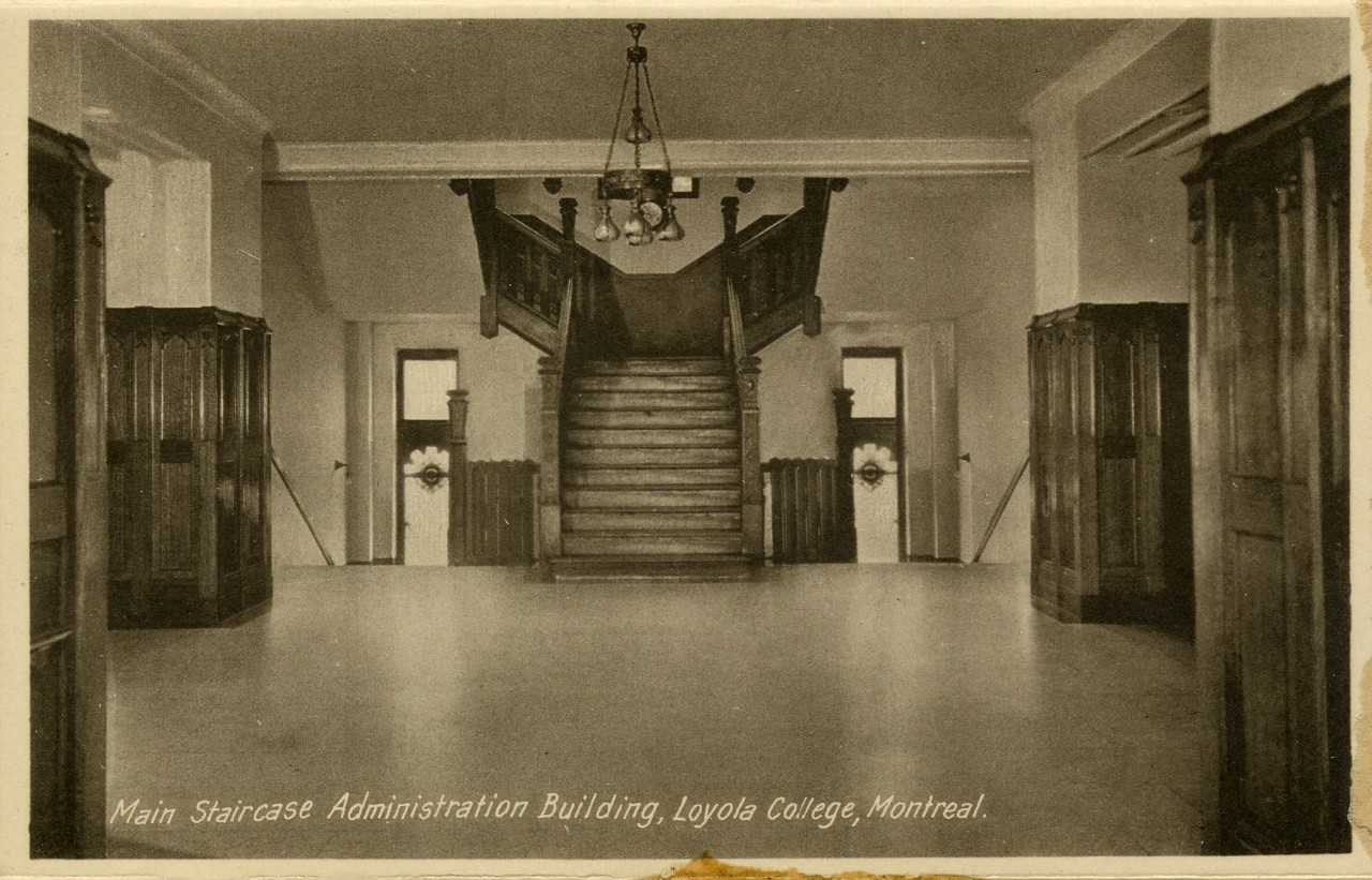 Old black and white photo of the main staircase in the Administration building