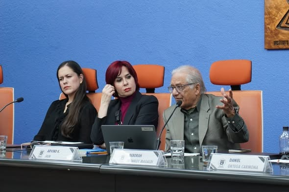 photo of sitting 3 panelists discussing book Understanding Political Corruption