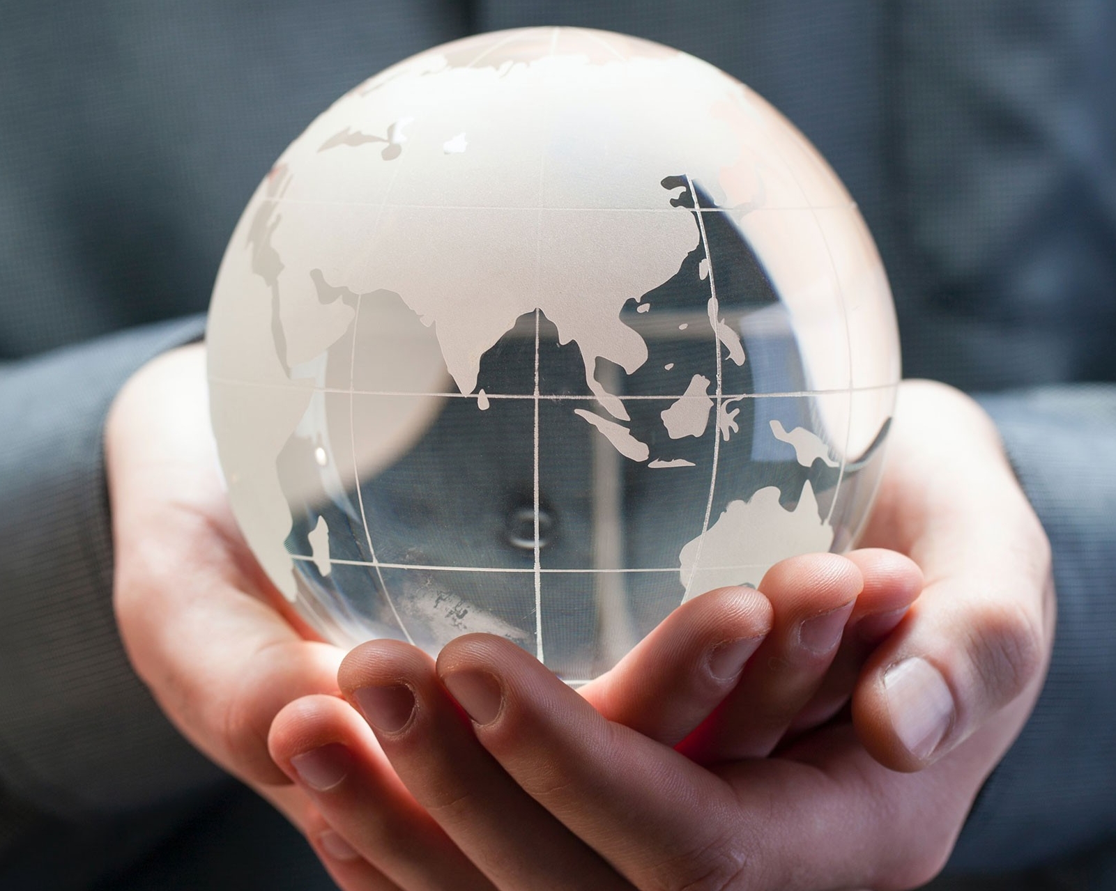 Hands holding a globe
