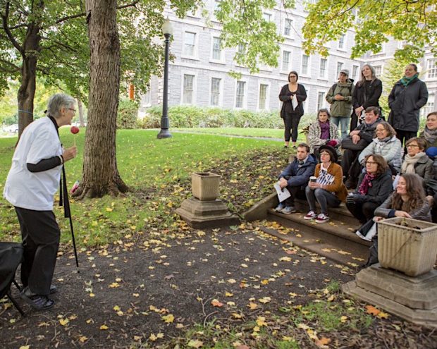 A woman speaking to a group of event participants