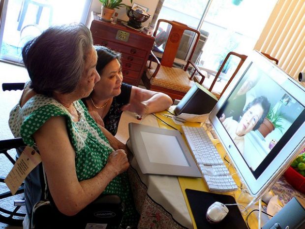 Two women looking at a computer monitor