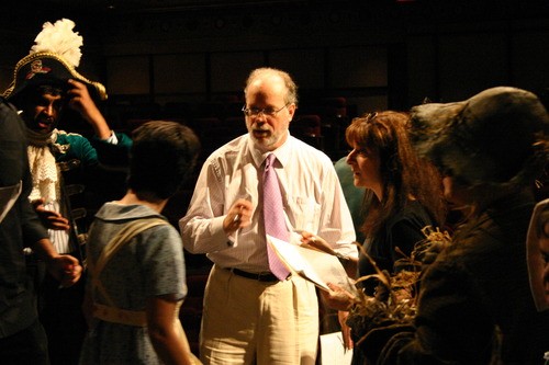 Director Dr. Stephen Snow speaks with the cast and crew before the performance 