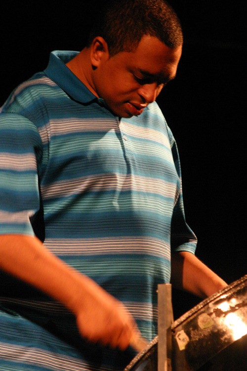 Performer playing the steel drums