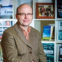 Headshot of Steven High who is an interdisciplinary historian