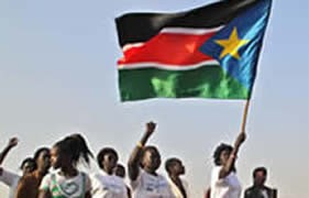 Women carry a flag of New Republic of South Sudan